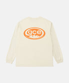 Back view of a Gramicci natural pigment colored GCE Long Sleeve Tee Pigment Dyed with a graphic against a light-tone background.