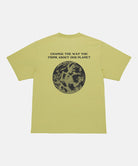 Back view of a Gramicci sweet pea colored Earth Tee with a graphic against a light-tone background.