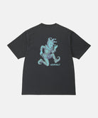 Back view of a Gramicci vintage black Joker Tee with a teal graphic against a light-tone background.