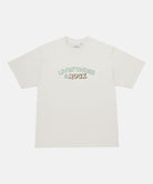 Gramicci natural pigment colored Livin' Tee Pigment Dyed with a Livin' Under A Rock graphic against a light-tone background.