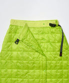 Close-up view of a lime colored Gramicci G-Zero Primaloft Skirt against a light-tone background.