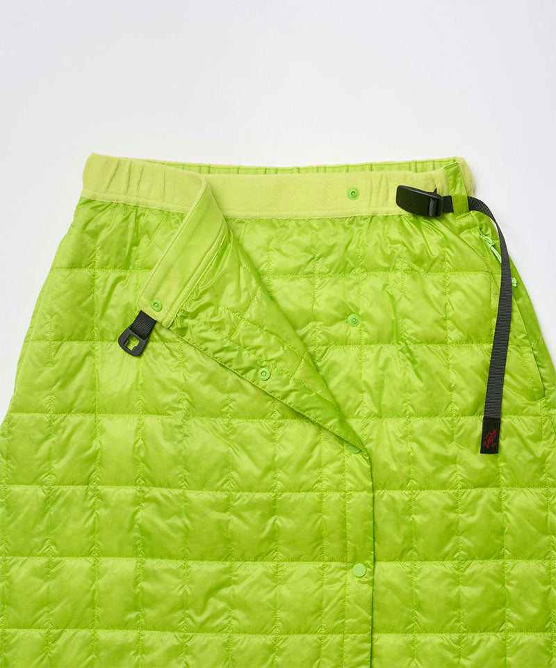 Close-up view of a lime colored Gramicci G-Zero Primaloft Skirt against a light-tone background.