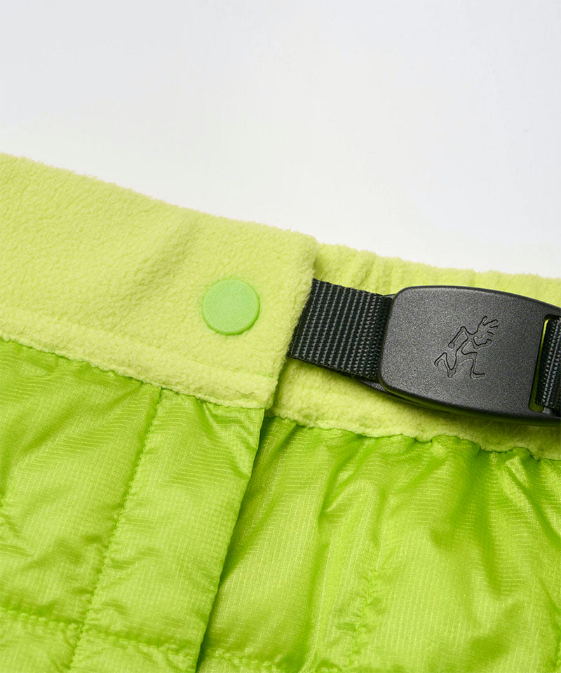 Close-up view of a lime colored Gramicci G-Zero Primaloft Skirt against a light-tone background.