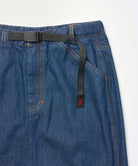 Close-up view of a stone colored Gramicci Denim Carpenter Skirt against a light-tone background.