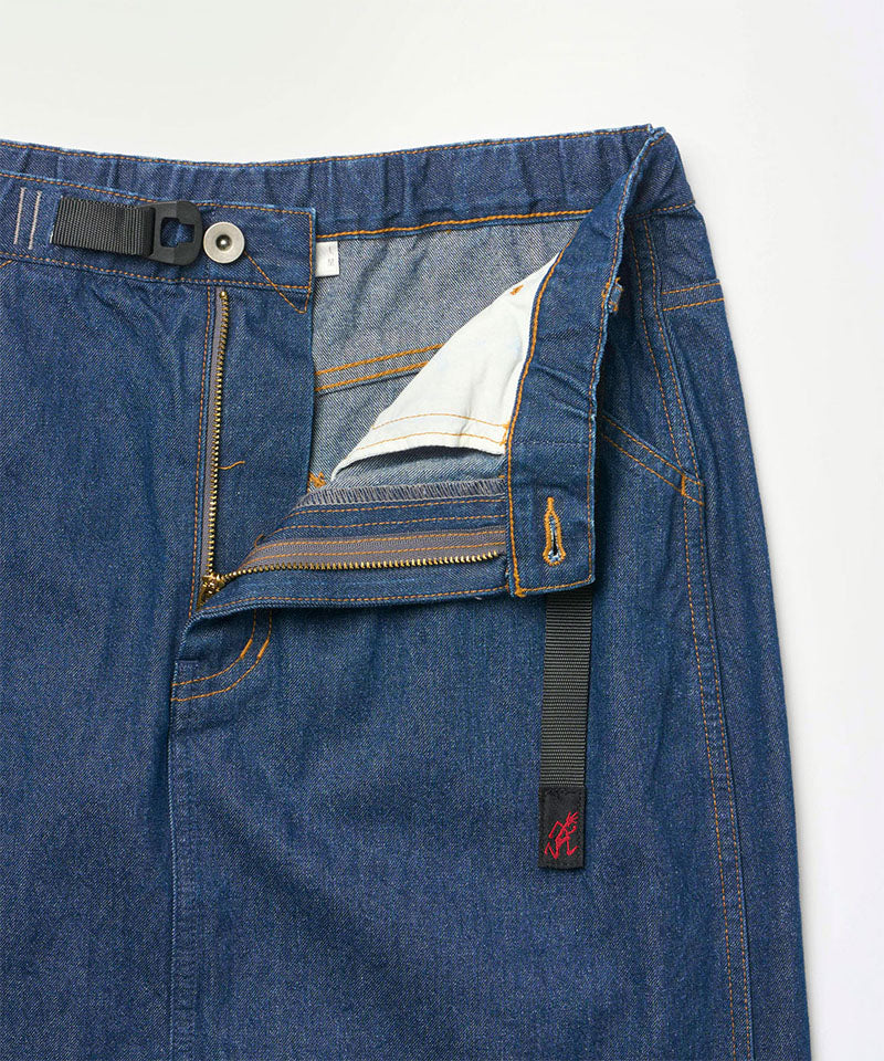 Close-up of the waistband on a stone colored Gramicci Gramicci Denim Carpenter Skirt on a light-tone background.