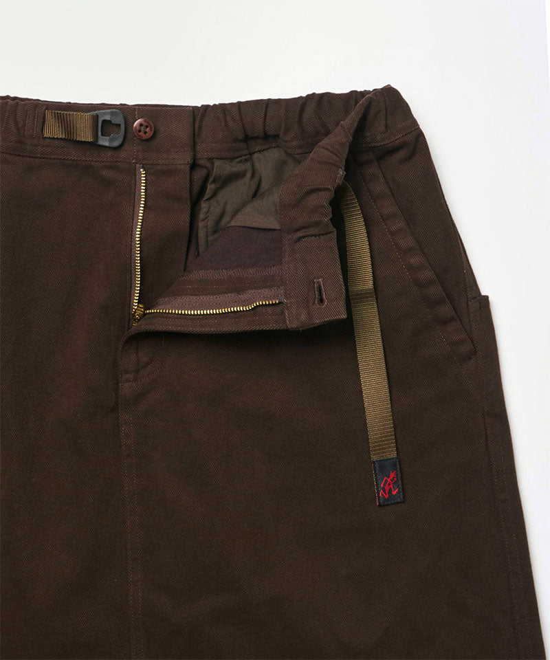 Close-up view of a coffee colored Gramicci Venture Skirt against a light-tone background.