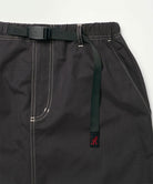 Close-up view of a black women's Gramicci WR Convertible Skirt against a light-tone background.