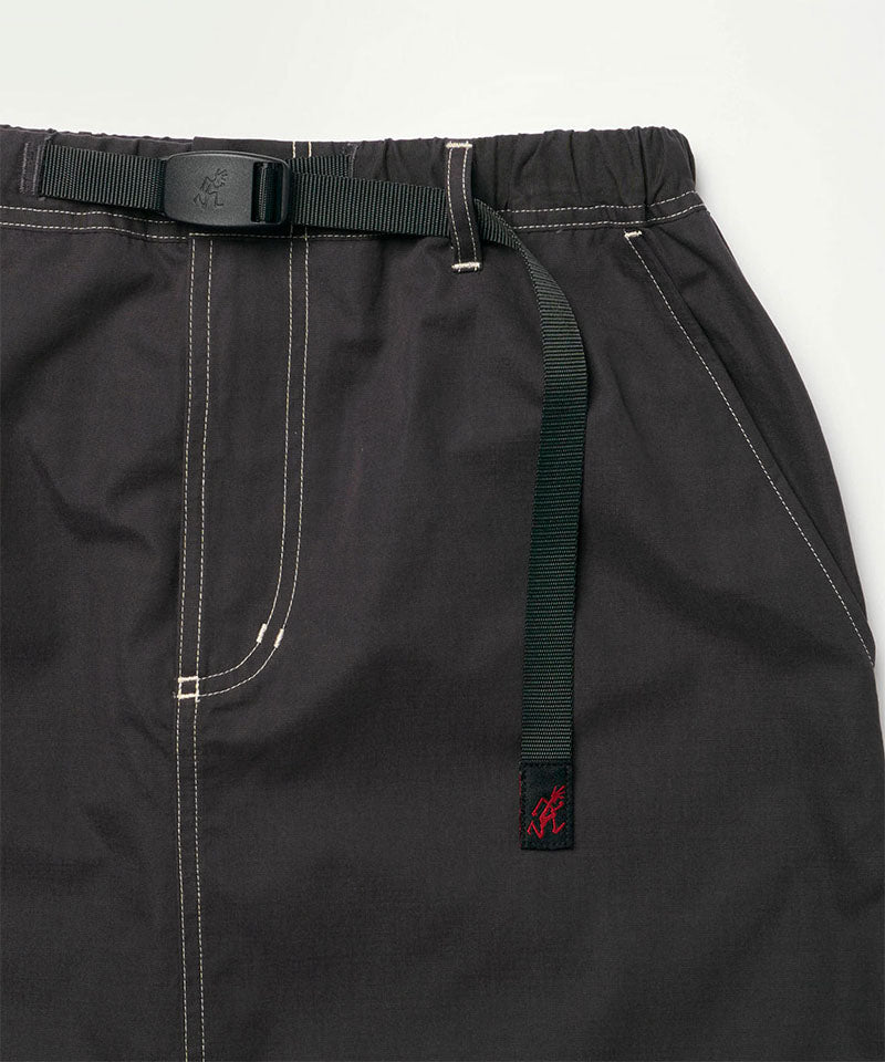 Close-up view of a black women's Gramicci WR Convertible Skirt against a light-tone background.