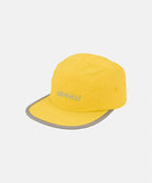 Banana colored Nylon Gramicci Cap
with a gray brim on a light tone background.