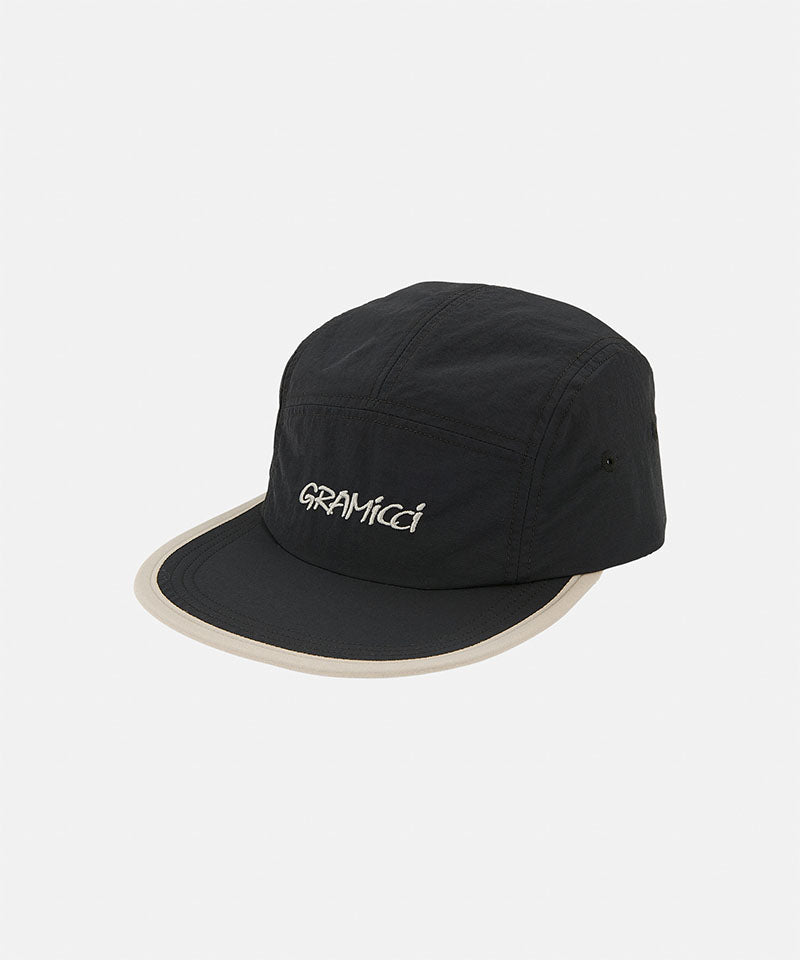 Black Nylon Gramicci Cap with a grey rim on a light tone background.