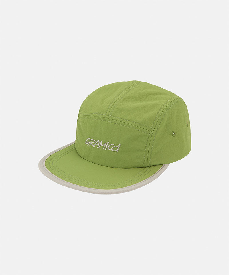 Jade green Nylon Gramicci Cap with a gray rim on a light tone background.
