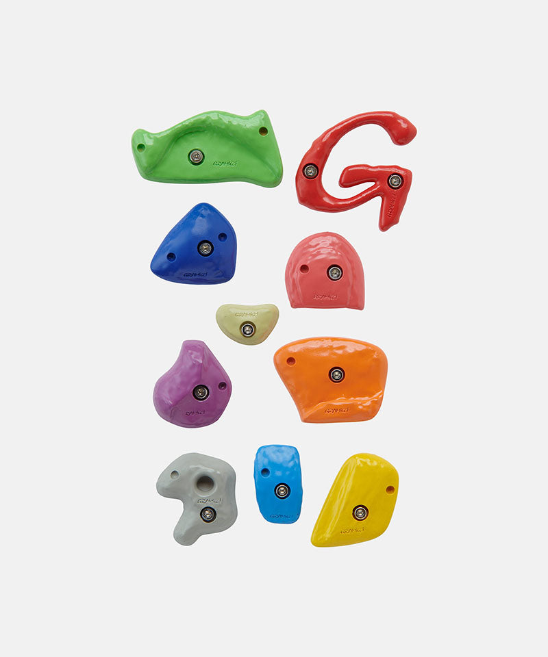 Set of colorful climbing holds on a white background