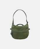 Olive Gramicci Field Sacoche bag against a light-tone background.