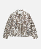Gramicci grey reed camouflage Taos Canvas Jacket against a light-tone background.
