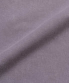 Close-up of Gramicci Natural Dyed purple fabric with a subtle pattern