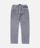 Back view of a Gramicci natural dyed grey Gadget Pants against a light-tone background.
