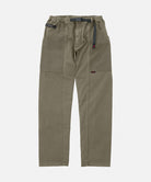 Gramicci natural dyed olive Gadget Pants with a black belt against a light-tone background.
