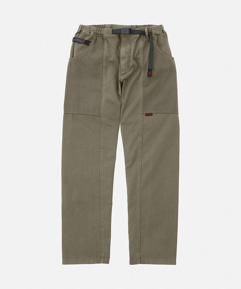 Gramicci natural dyed olive Gadget Pants with a black belt against a light-tone background.
