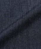 Gramicci navy colored Japanese Chambray Rock Slide Pants fabric swatch.