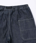 Back view close-up of Japanese Chambray Rock Slide Pants in the color navy against a light-tone background.