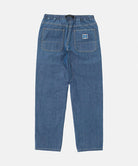 Rear view of the Gramicci Japanese Chambray Double Knee pant in blue against a light tone background.
