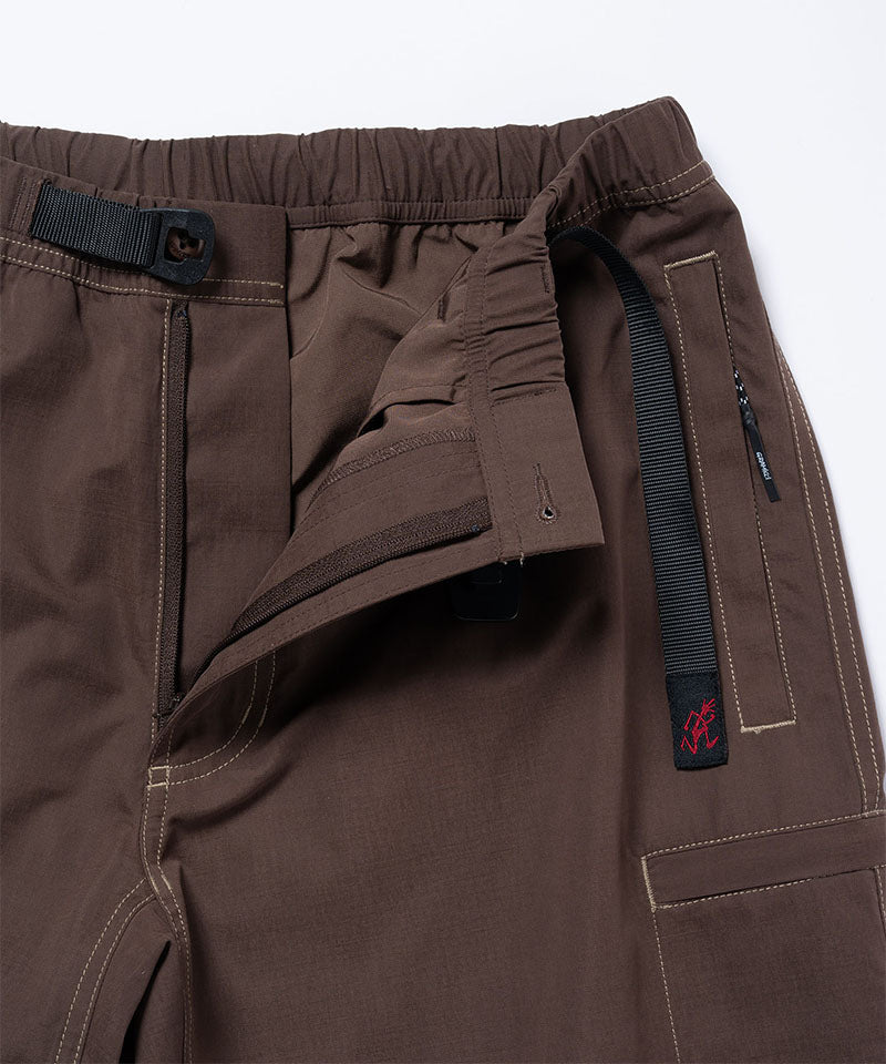 Close-up of Gramicci Milton Pants in the color walnut against a light-tone background.