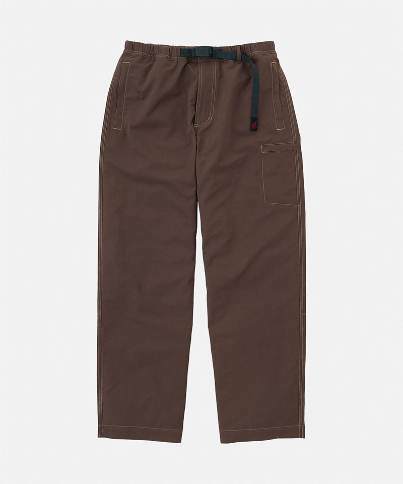 Gramicci Milton Pants in walnut with a black belt against a light-tone background.