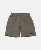 Khaki shorts with a small logo on a light gray background