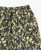 Camouflage shorts with a brand logo on a white background