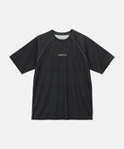Gramicci black checkered UPF Shield S/S Top with a grey Gramicci graphic against a light-tone background.
