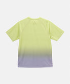 Back view of a Gramicci yellow gradient UPF Shield S/S Top with a white Gramicci graphic against a light-tone background.
