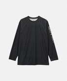 Gramicci black UPF Shield S/S Top with a sleeve graphic against a light-tone background.
