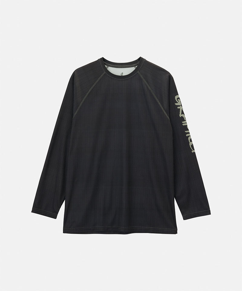 Gramicci black UPF Shield S/S Top with a sleeve graphic against a light-tone background.
