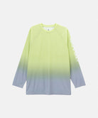 Gramicci yellow gradient UPF Shield S/S Top with a sleeve graphic against a light-tone background.
