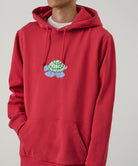 Red hoodie with a turtle graphic on a gray background