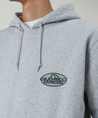 Gray hoodie with Gramicci logo on a light gray background