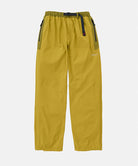 Olive yellow pants with black accents on a light tone background
