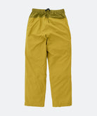 Olive yellow pants on a light tone background