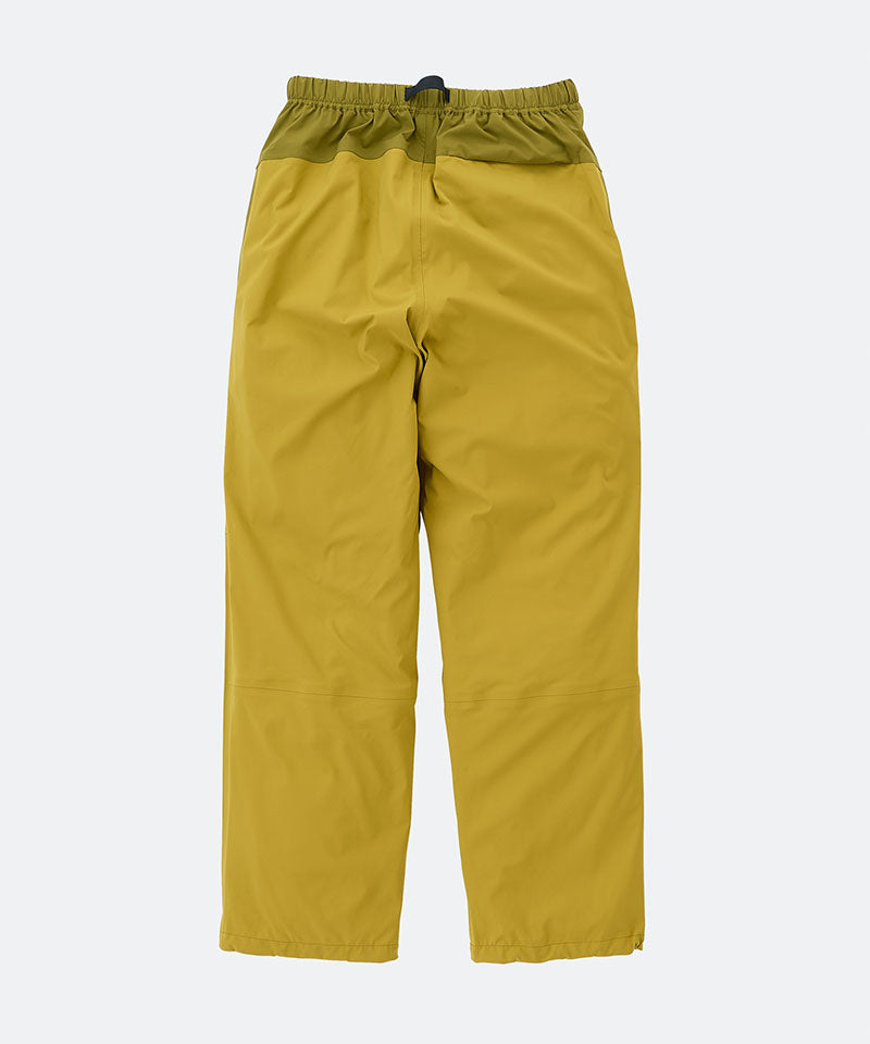 Olive yellow pants on a light tone background