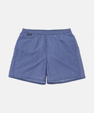 Front view of navy checkered Gramicci Grid Swim Shorts against a light-tone background.
