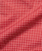 Close-up of red checkered fabric with a visible pattern