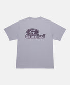 Back view of a Gramicci light lavender '82 Tee with dark lavender graphic against a light tone background.