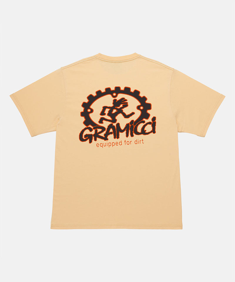 Back view of a Gramicci mango colored Equipped For Dirt Tee with a graphic against a light-tone background.