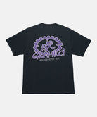 Back view of a Gramicci vintage black Equipped For Dirt Tee with a purple graphic against a light-tone background.