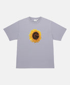 Gramicci lavender G-Flower Tee with sunflower graphic against a light tone background.