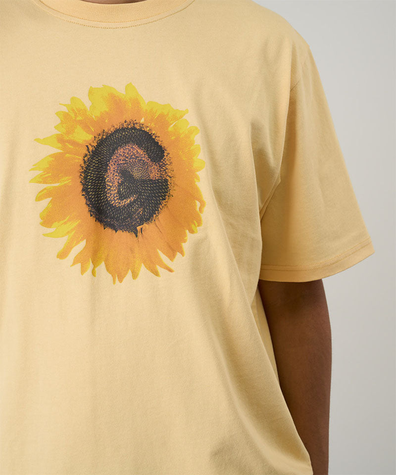 Gramicci mango G-Flower Tee with sunflower graphic against a light tone background.
