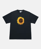 Gramicci vintage black G-Flower Tee with sunflower graphic against a light tone background.