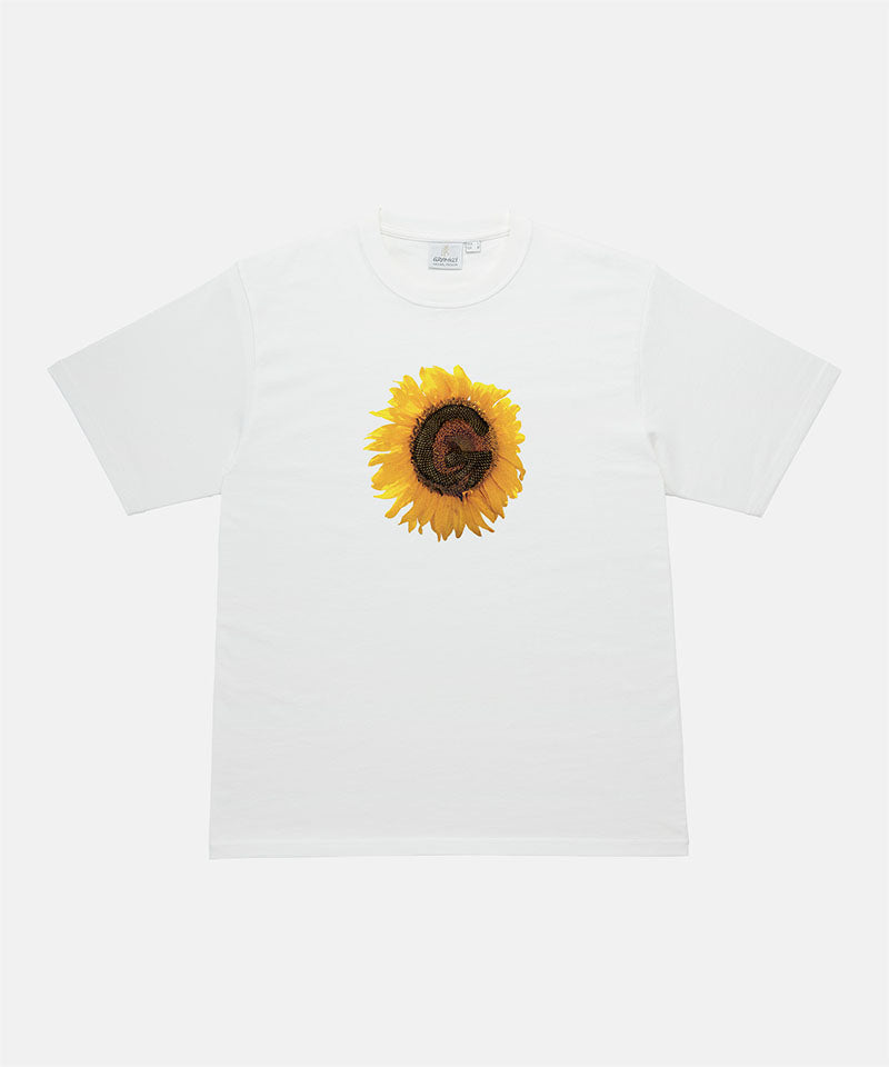 Gramicci white G-Flower Tee with sunflower graphic against a light tone background.