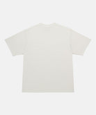 Back view of a Gramicci natural pigment Freedom Tee Pigment Dyed against a light tone background.