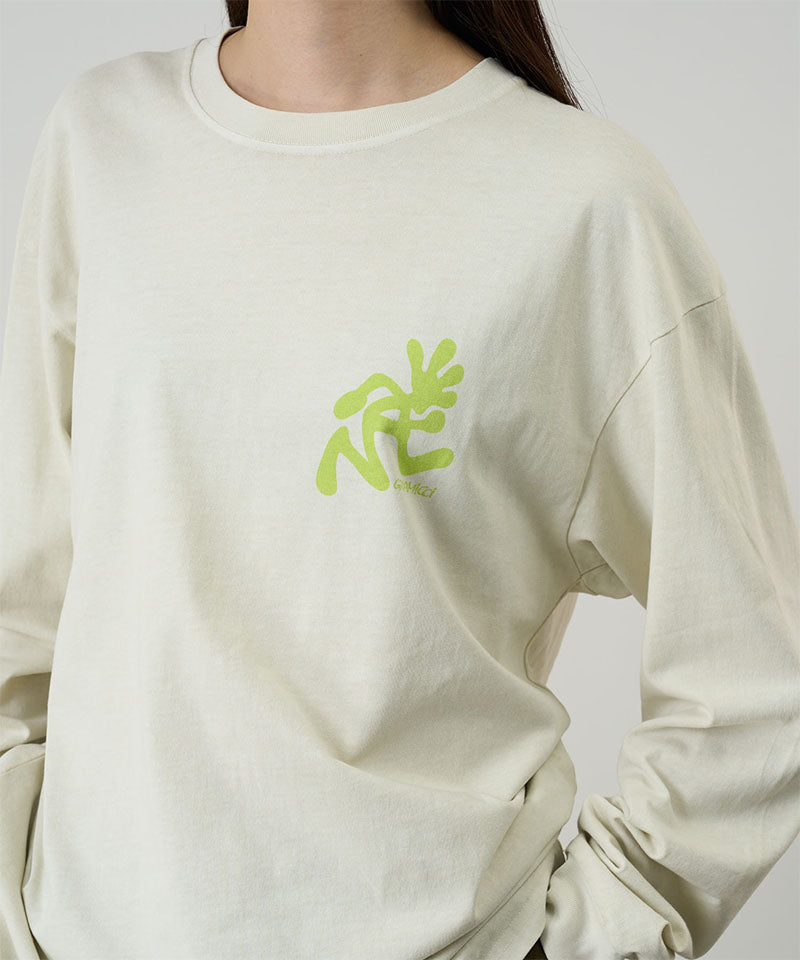 Model wearing a Gramicci natural pigment Running Man L/S Tee Pigment Dyed with a lime green graphic against a light-tone background.